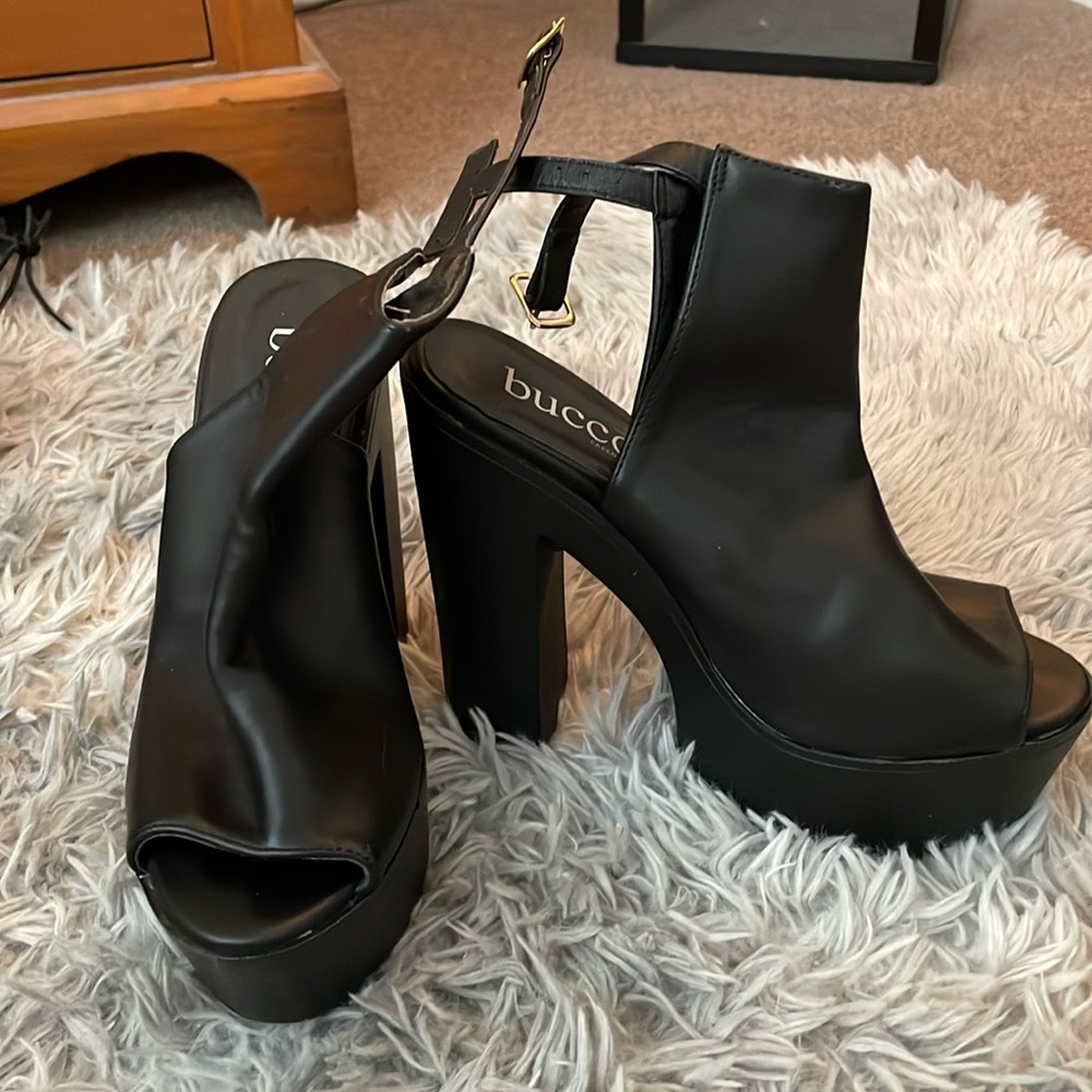 Bucco platform heeled open toe booties.